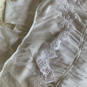 White off the shoulder lace dress.